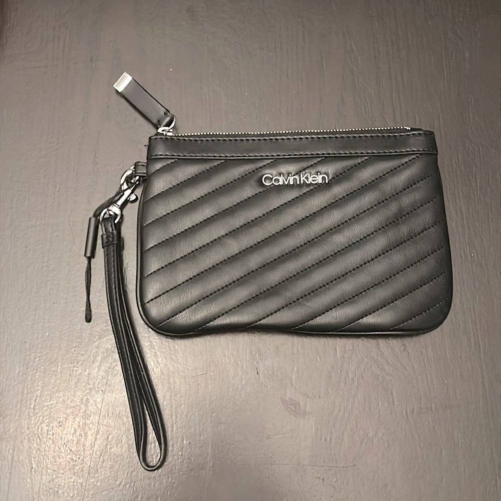 NWOT Calvin Klein black Wristlet with silver hardware